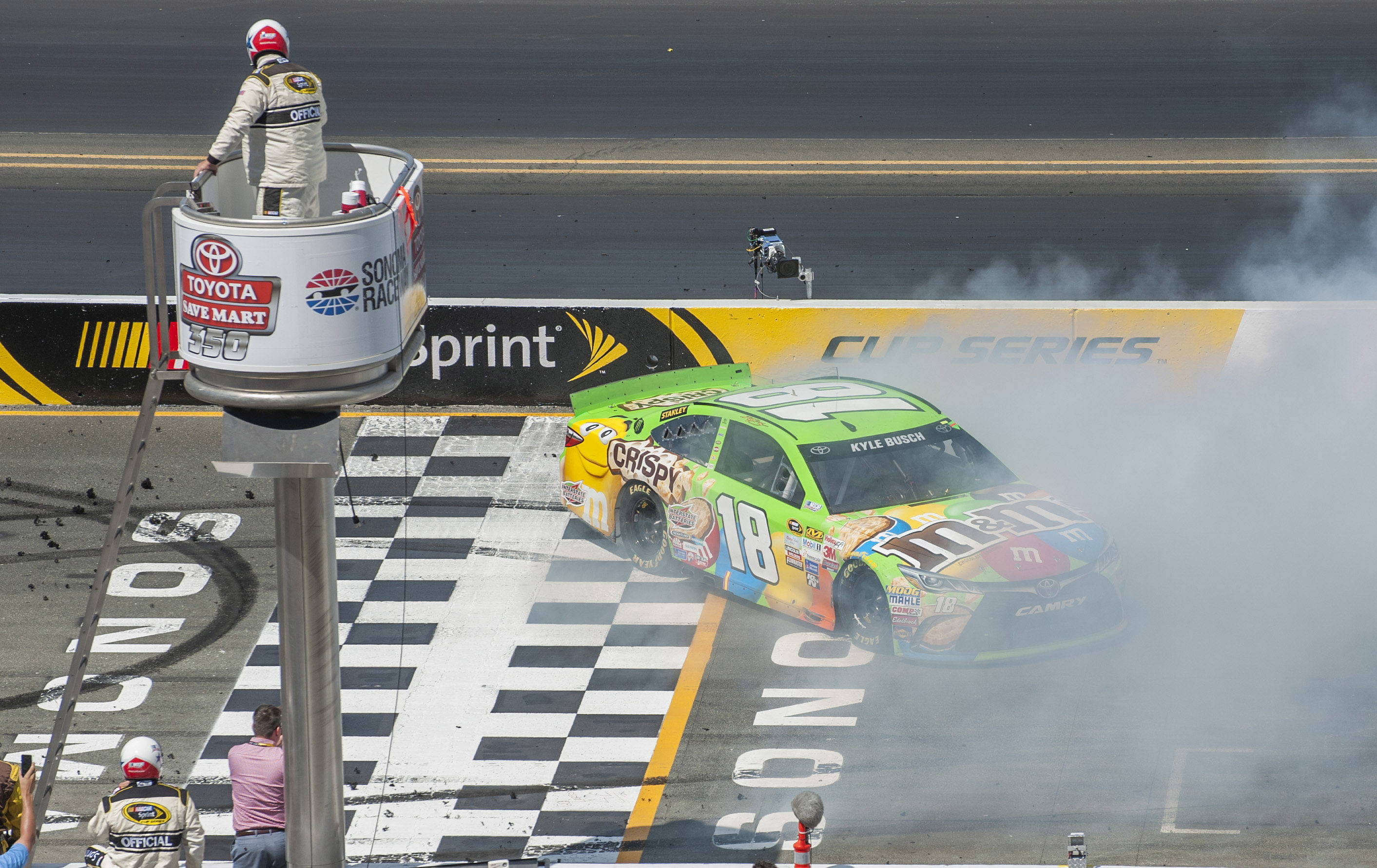 Kyle Busch (18) at the finish line after winning the Toyota/SaveMart 350 at Sonoma. Source: Imagn